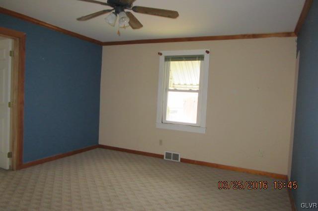 4010 Green Pond Road Easton, PA 18045 - Photo 7 of 17 an empty room with a window and a fan