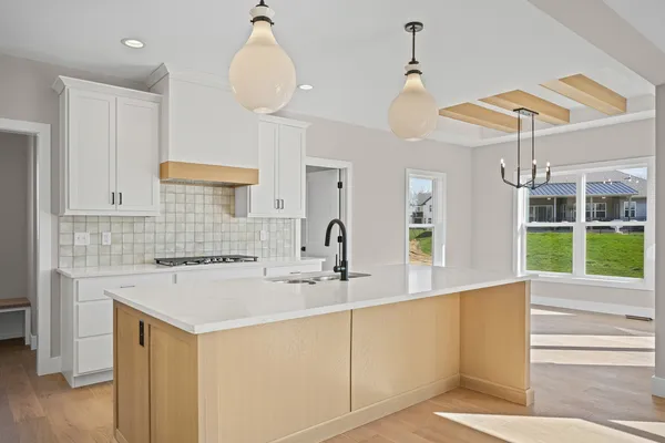 a kitchen with a sink cabinets and window