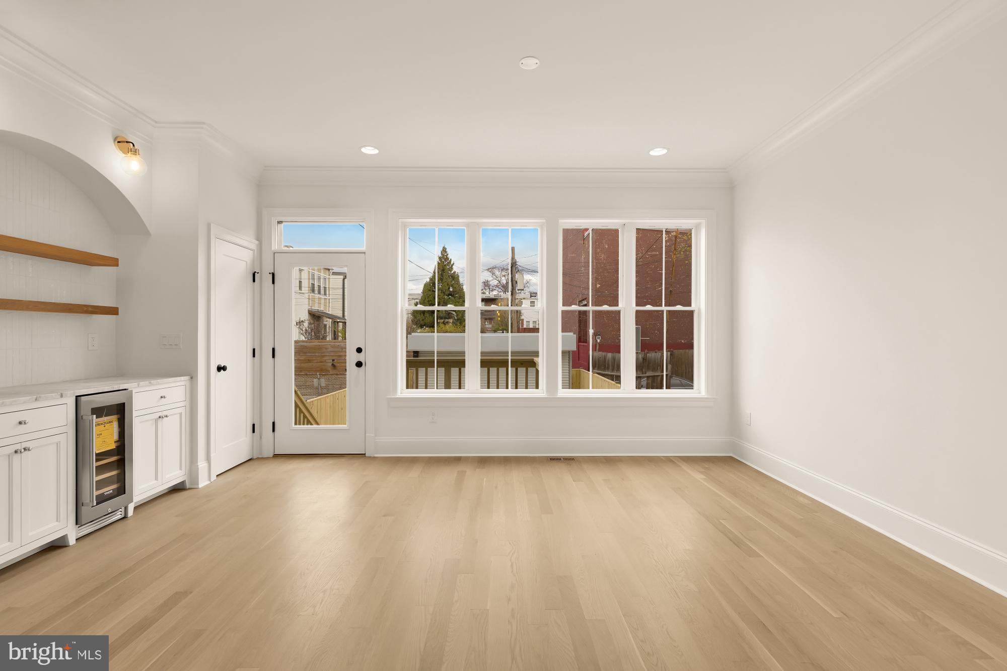 1010 I Street Northeast Washington, DC 20002 - Photo 19 of 51 a view of an empty room with a window and wooden floor