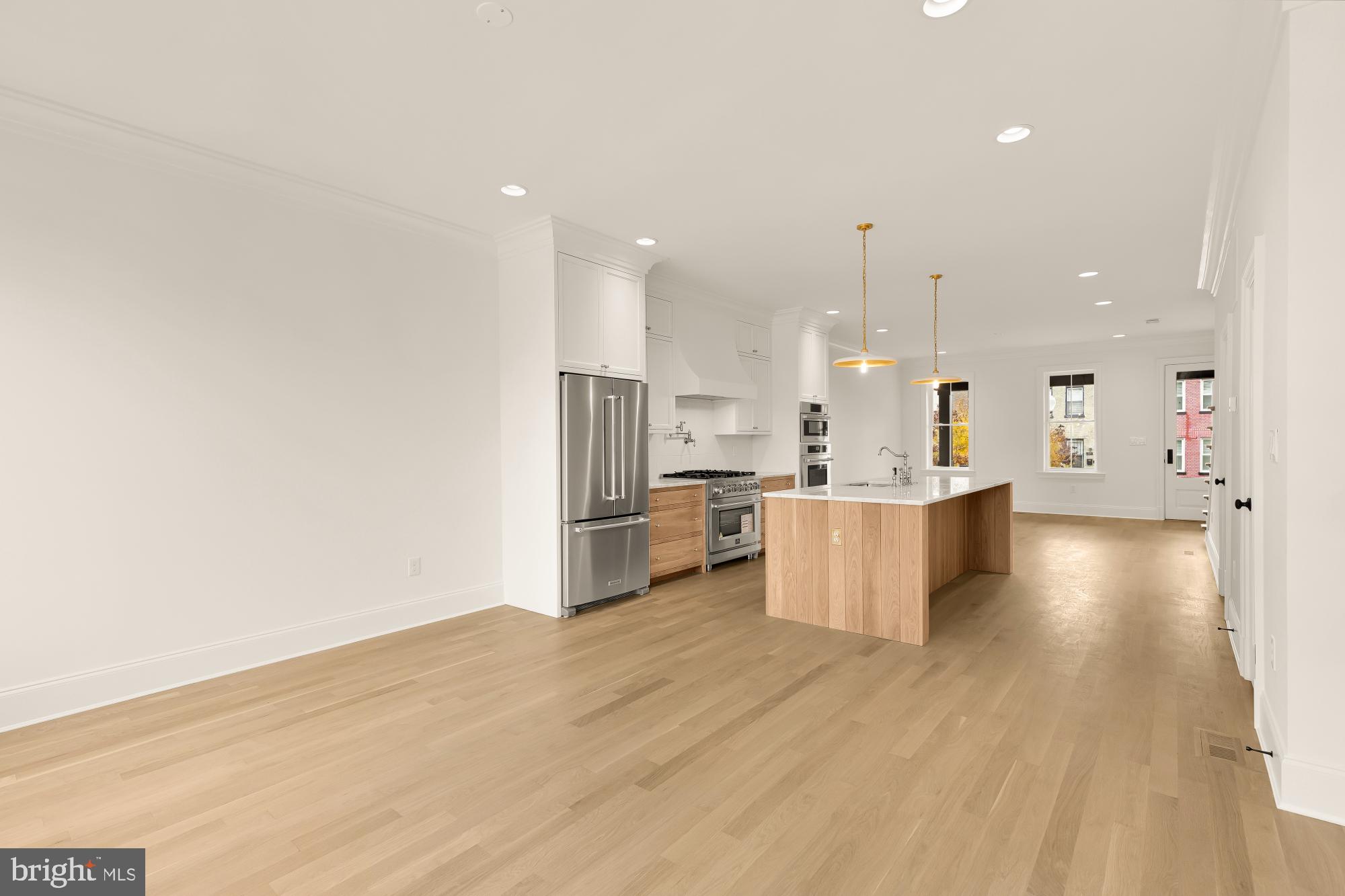 1010 I Street Northeast Washington, DC 20002 - Photo 21 of 51 a view of kitchen with kitchen island white cabinets stainless steel appliances and sink