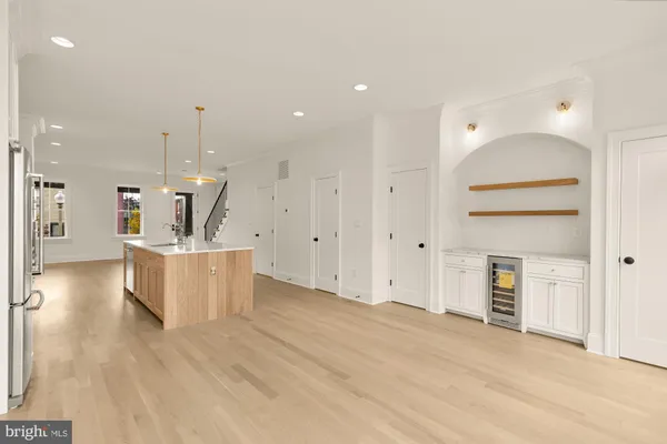 a view of kitchen with furniture and wooden floor
