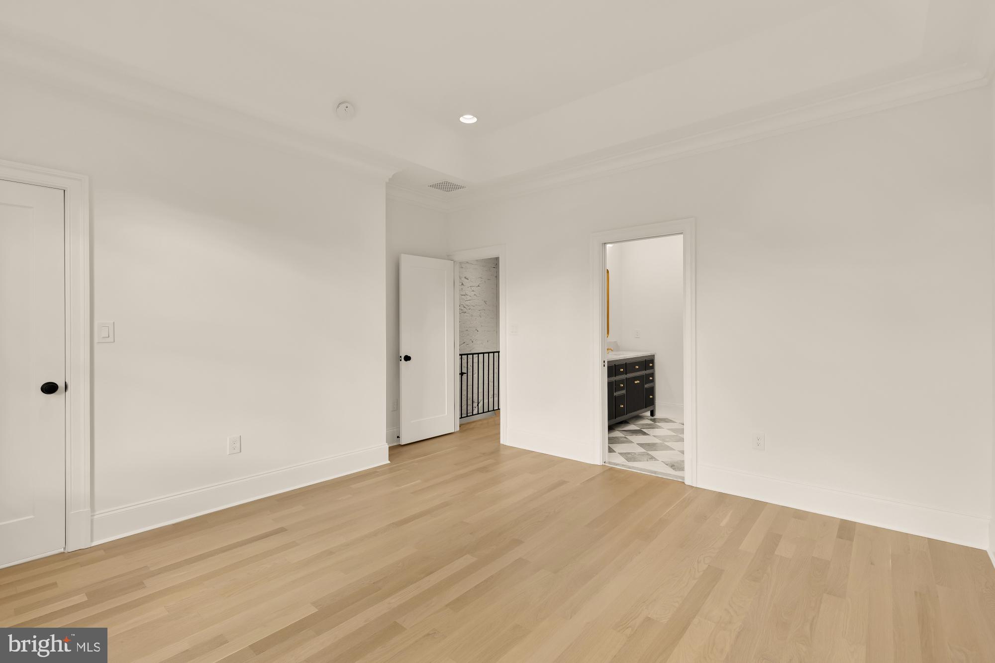 1010 I Street Northeast Washington, DC 20002 - Photo 26 of 51 a view of an empty room with wooden floor and cabinet