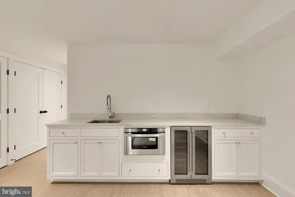 a kitchen with stainless steel appliances granite countertop a sink and a granite counter tops