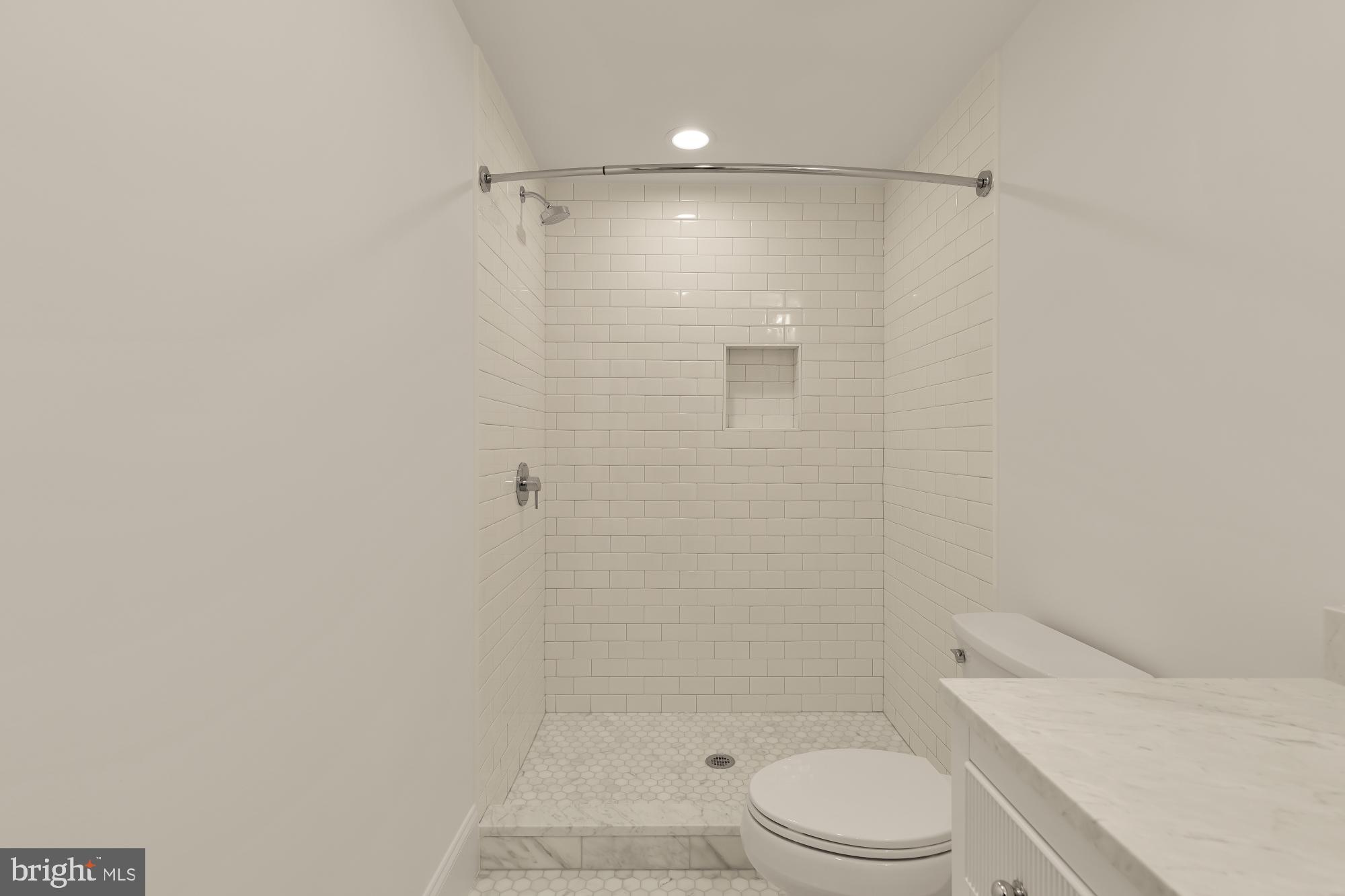 1010 I Street Northeast Washington, DC 20002 - Photo 42 of 51 a bathroom with a shower a toilet and sink