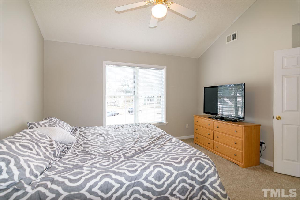 3500 Jaybee Court Raleigh, NC 27604 - Photo 15 of 26 a bedroom with a bed and a flat screen tv