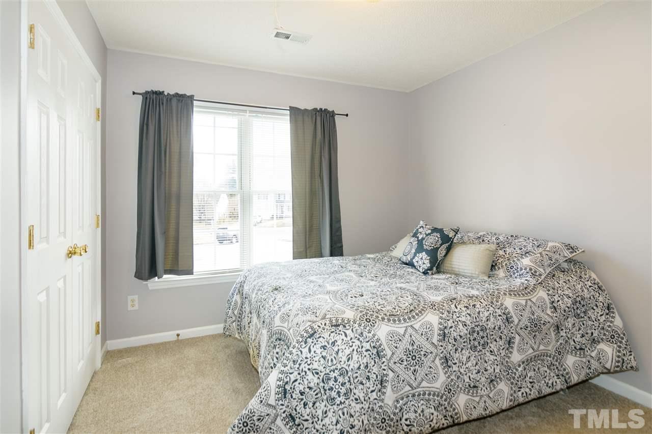 3500 Jaybee Court Raleigh, NC 27604 - Photo 18 of 26 a bedroom with a bed and a window