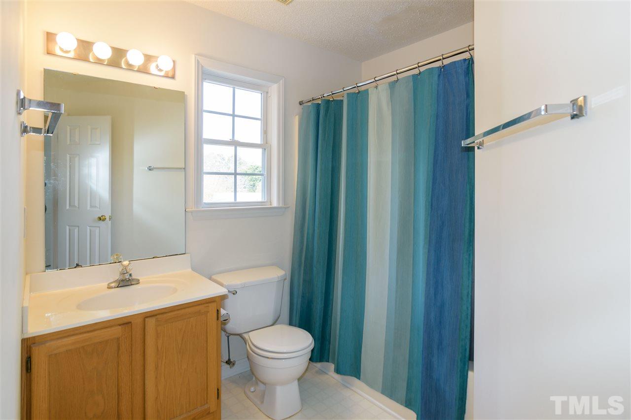 3500 Jaybee Court Raleigh, NC 27604 - Photo 19 of 26 a bathroom with a sink a toilet and shower