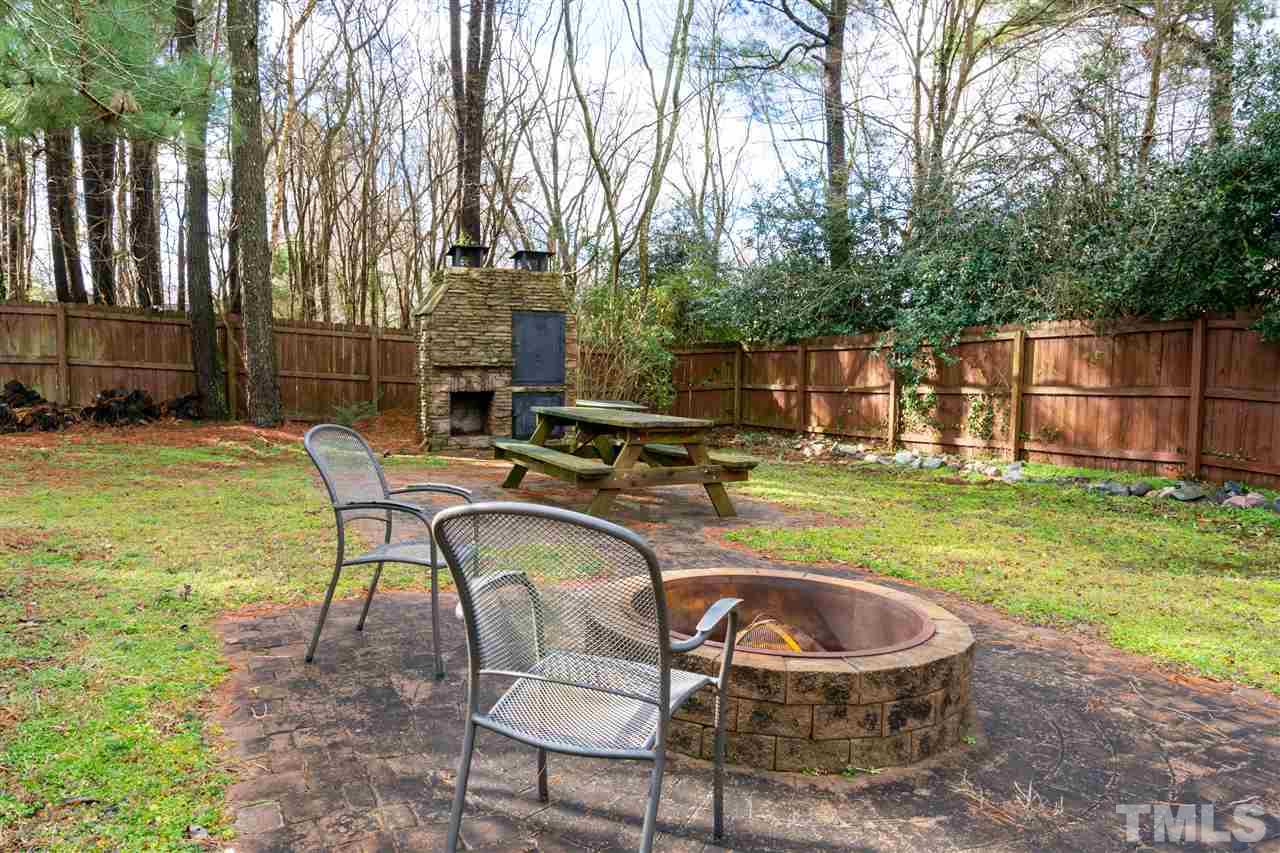 3500 Jaybee Court Raleigh, NC 27604 - Photo 24 of 26 a backyard of a house with table and chairs