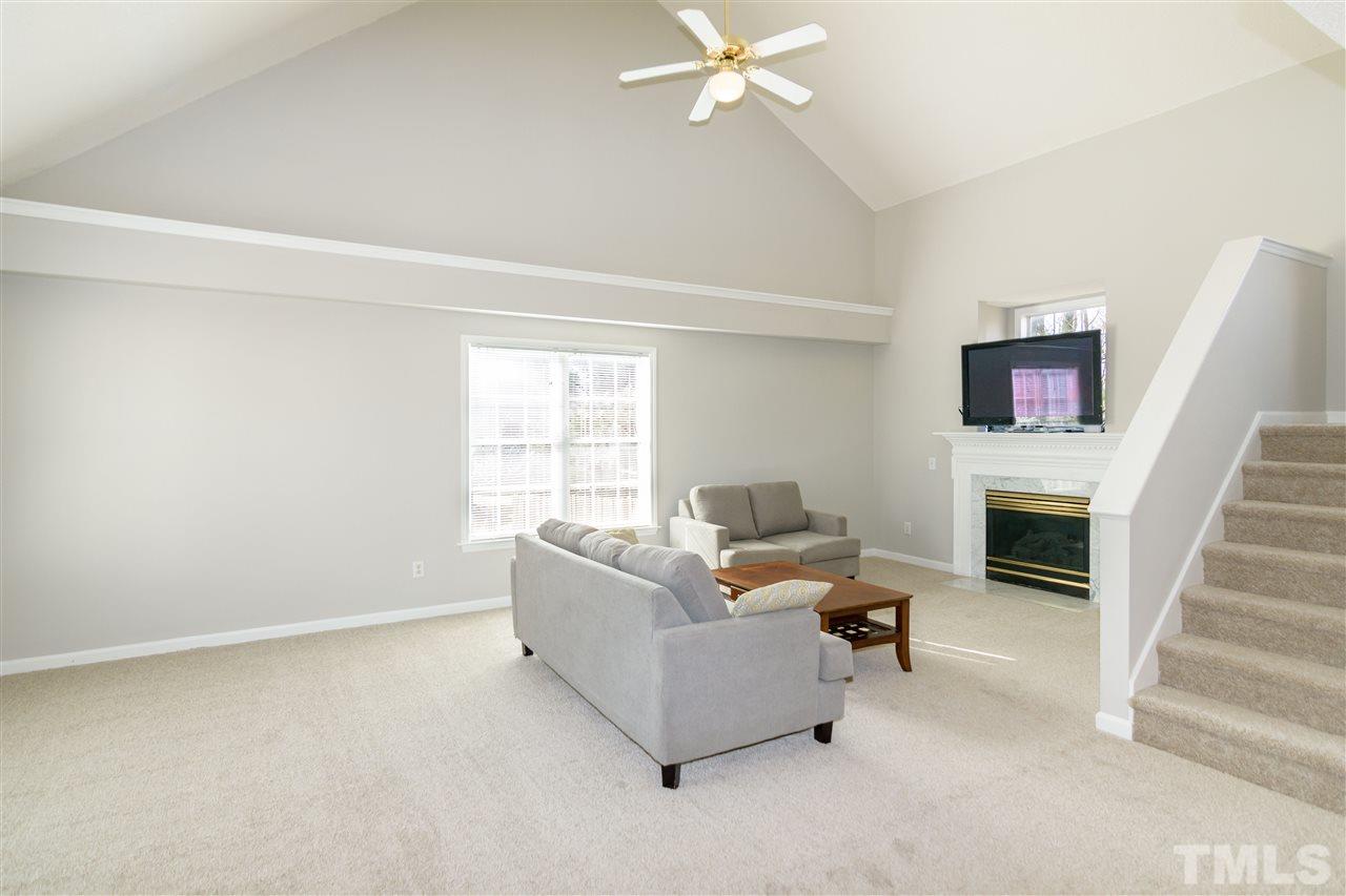 3500 Jaybee Court Raleigh, NC 27604 - Photo 4 of 26 a living room with furniture and a fireplace