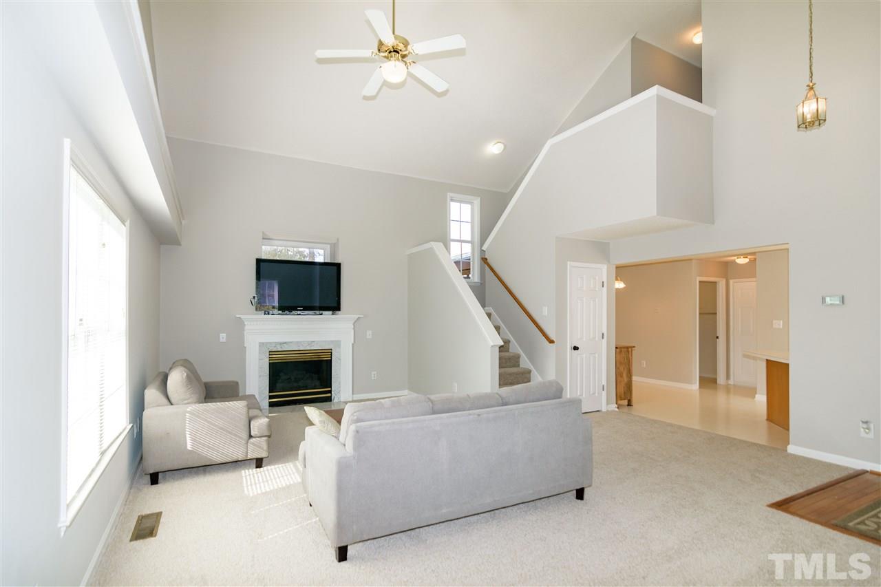 3500 Jaybee Court Raleigh, NC 27604 - Photo 6 of 26 a living room with furniture and a fireplace