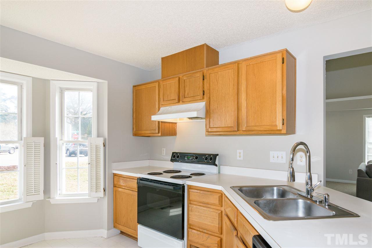 3500 Jaybee Court Raleigh, NC 27604 - Photo 9 of 26 a kitchen that has a sink and a stove
