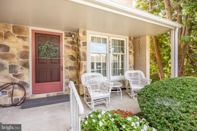 a balcony with furniture and a potted plant