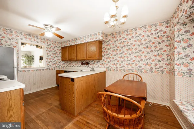 a kitchen with stainless steel appliances granite countertop a sink stove and microwave