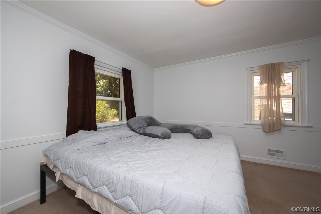 4609 Bruce Road Chester, VA 23831 - Photo 17 of 36 a bedroom with a bed and window