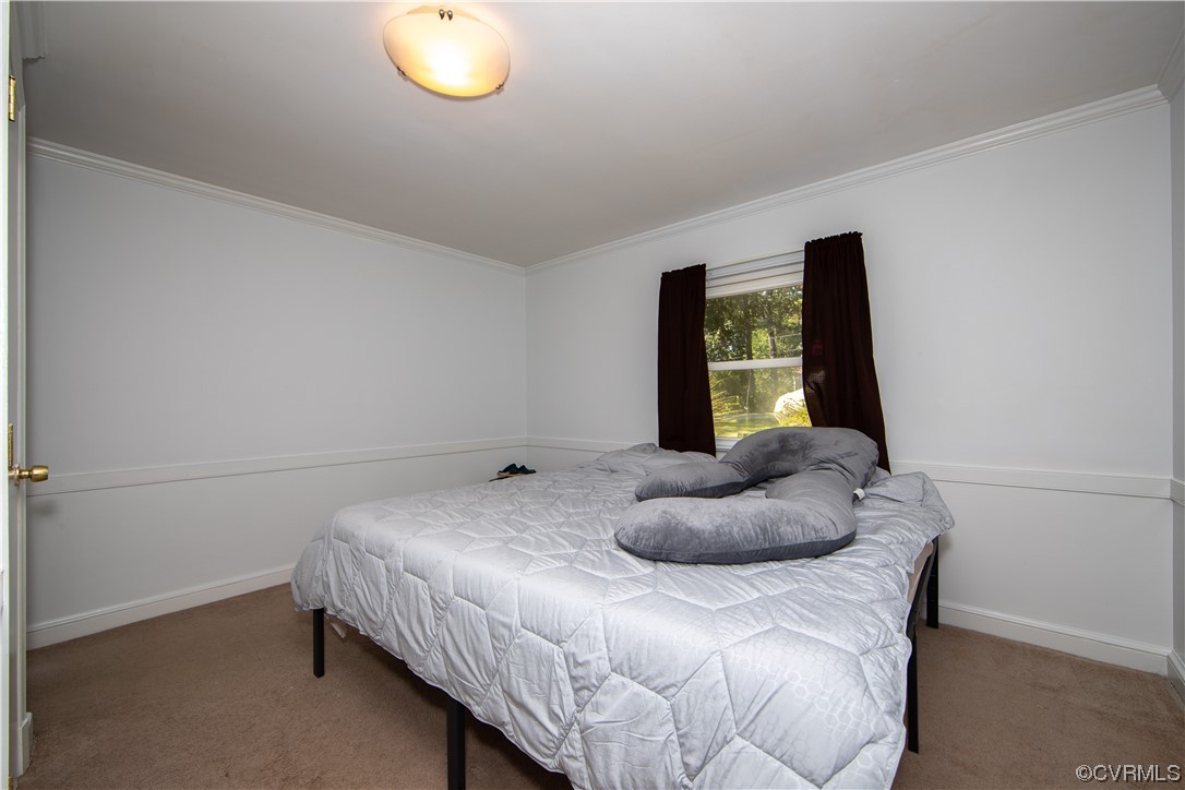 4609 Bruce Road Chester, VA 23831 - Photo 18 of 36 a bedroom with a bed and a window