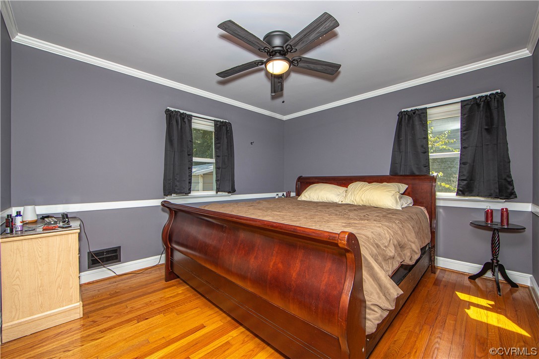 4609 Bruce Road Chester, VA 23831 - Photo 24 of 36 a bed sitting in a room next to a window