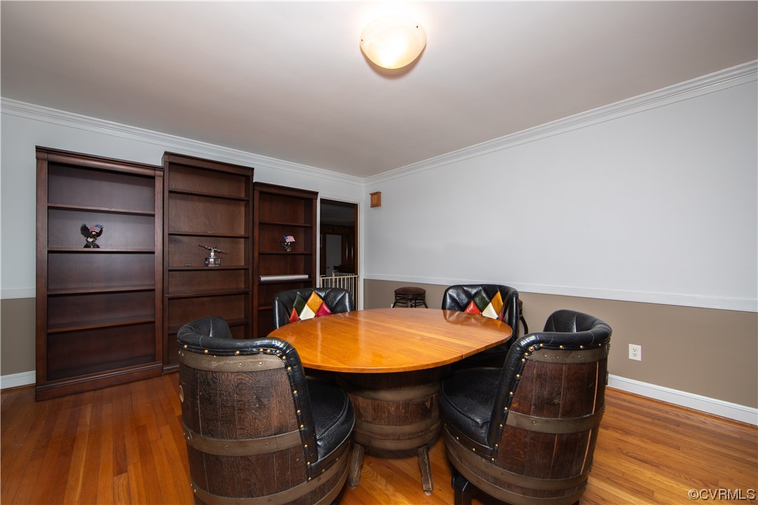 4609 Bruce Road Chester, VA 23831 - Photo 28 of 36 a room with furniture and wooden floor