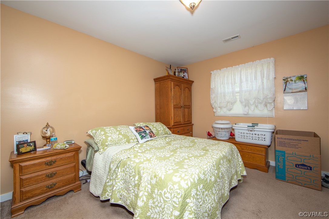 4609 Bruce Road Chester, VA 23831 - Photo 33 of 36 a bedroom with a bed and a dresser