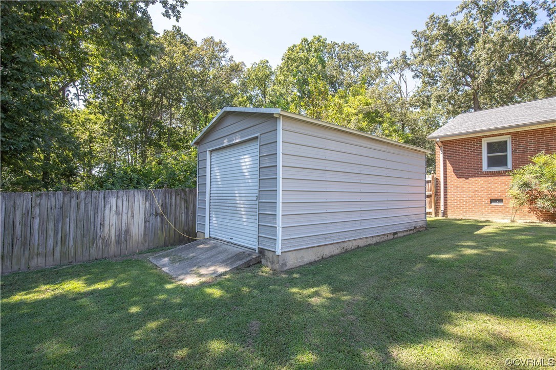 4609 Bruce Road Chester, VA 23831 - Photo 9 of 36 a view of backyard with potted plants and wooden fence