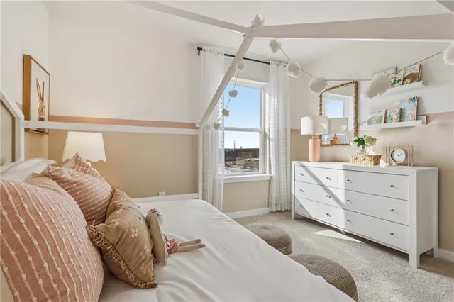 a bedroom with a bed and glass window