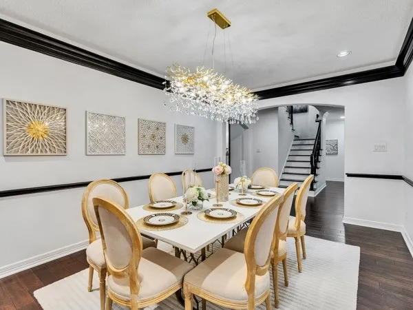 a dining room with furniture and window