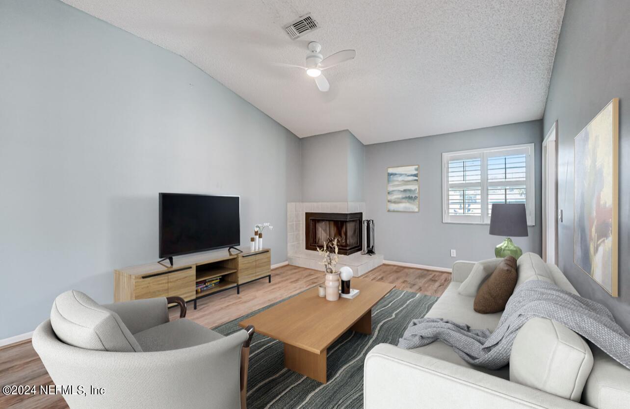 104 Tournament Road Ponte Vedra Beach, FL 32082 - Photo 6 of 50 a living room with furniture and a flat screen tv
