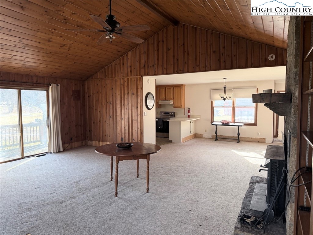 2752 Broadstone Road Banner Elk, NC 28604 - Photo 19 of 24 a view of a livingroom with furniture and a ceiling fan