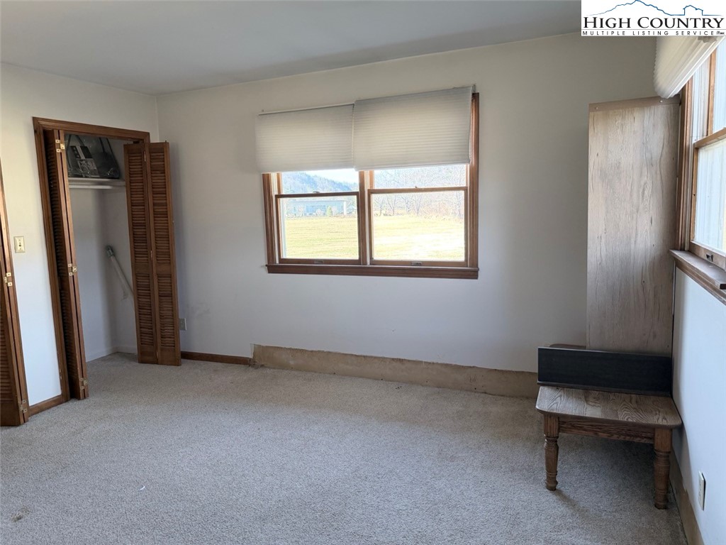 2752 Broadstone Road Banner Elk, NC 28604 - Photo 21 of 24 a view of an empty room with a window
