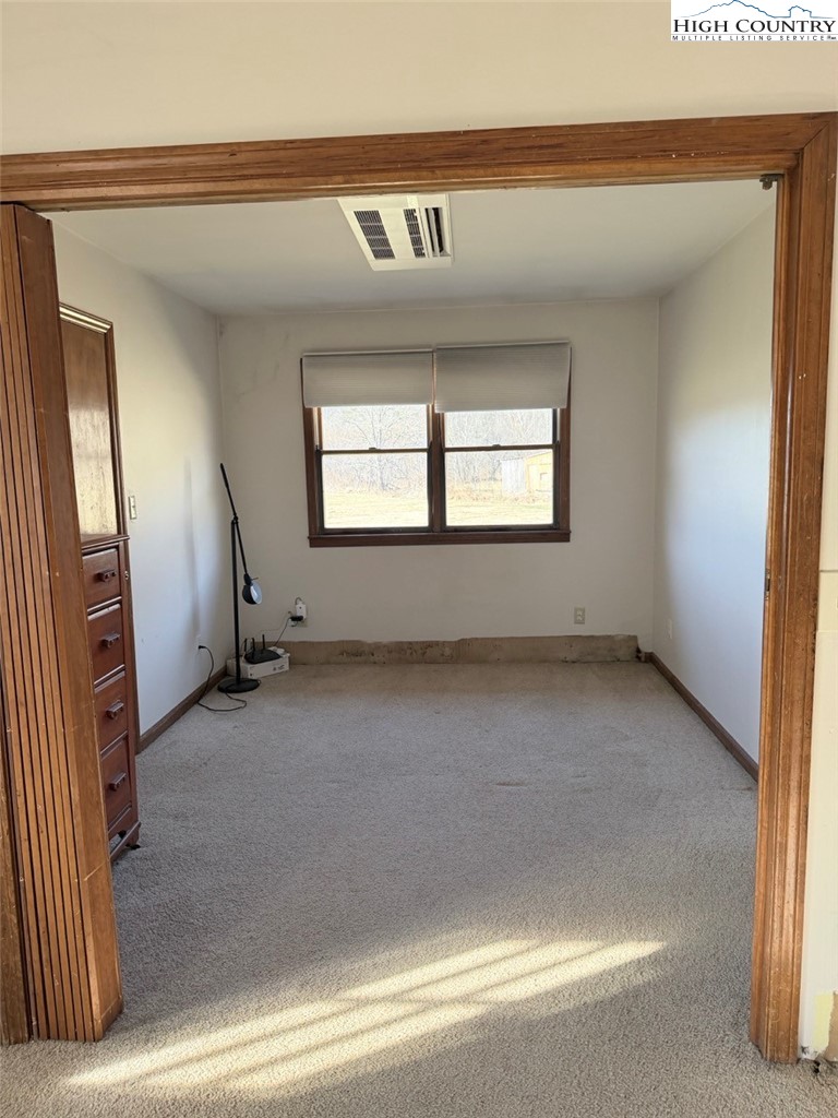 2752 Broadstone Road Banner Elk, NC 28604 - Photo 22 of 24 an empty room with windows