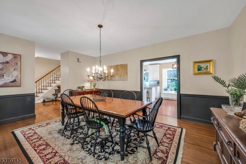 40 Heiser Road Port Murray, NJ 07865 - Photo 17 of 48 a dining room with furniture a rug and a chandelier