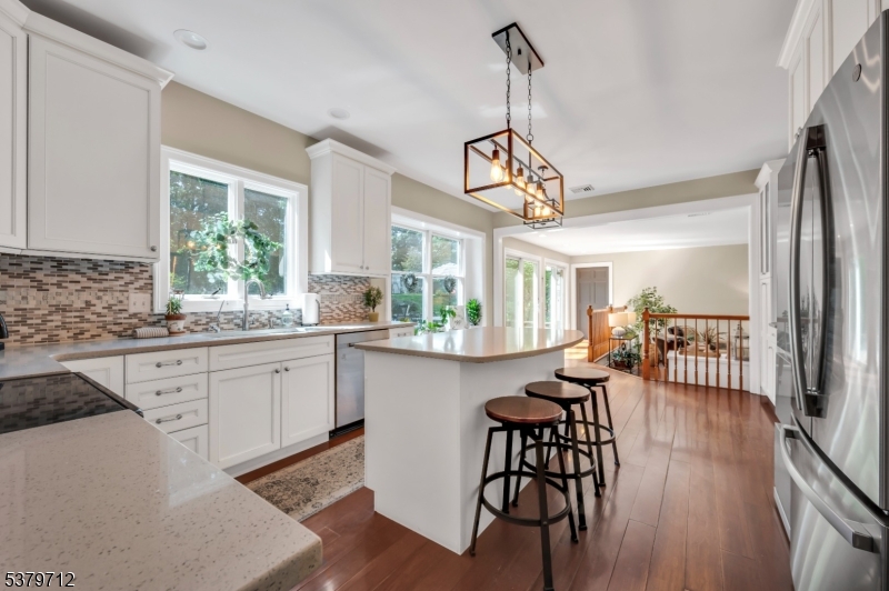 40 Heiser Road Port Murray, NJ 07865 - Photo 21 of 48 a very nice looking dining room with wooden floor a chandelier a wooden table and chairs