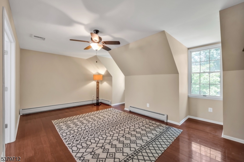 40 Heiser Road Port Murray, NJ 07865 - Photo 32 of 48 an empty room with wooden floor chandelier fan and windows