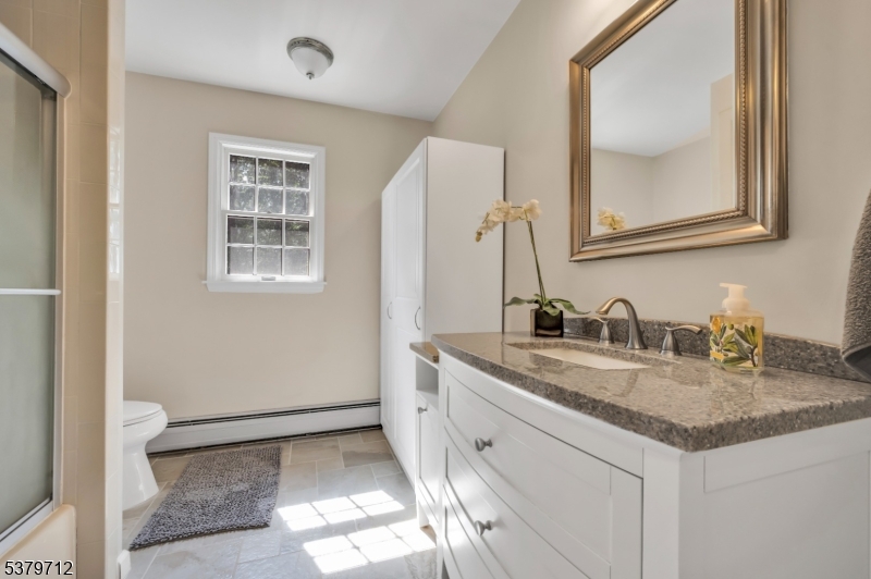 40 Heiser Road Port Murray, NJ 07865 - Photo 36 of 48 a bathroom with a granite countertop sink and a mirror