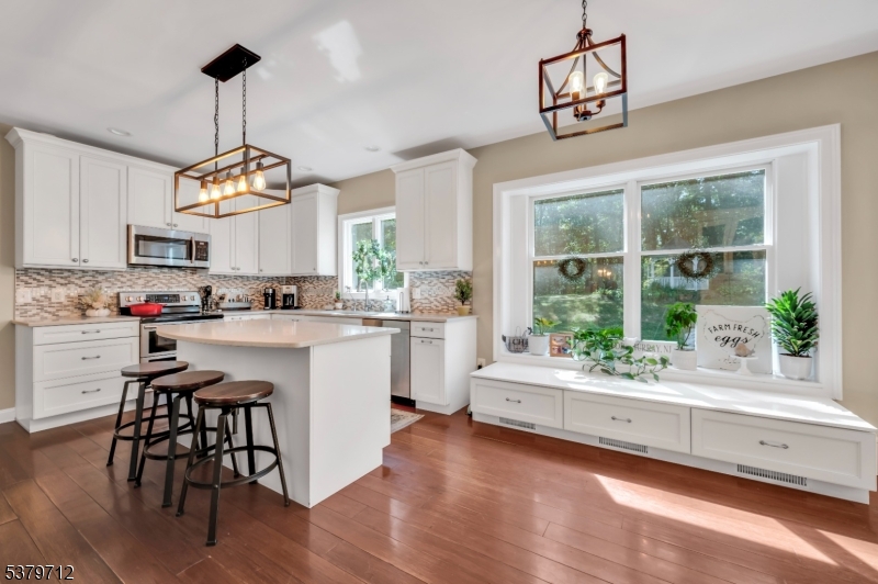 40 Heiser Road Port Murray, NJ 07865 - Photo 4 of 48 a kitchen with a table and chairs in it