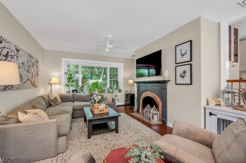 40 Heiser Road Port Murray, NJ 07865 - Photo 5 of 48 a living room with furniture a fireplace and a flat screen tv