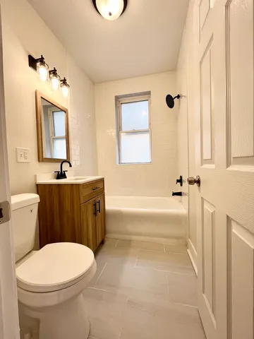 a bathroom with a sink a toilet and a bathtub