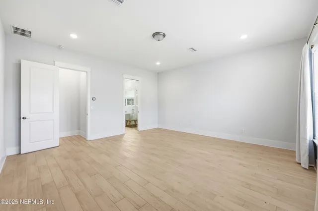 a bathroom with a double vanity sink and a toilet