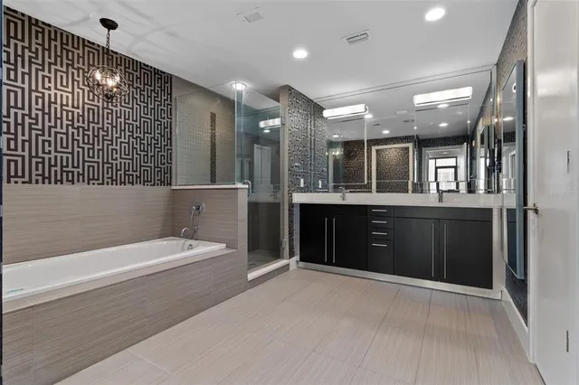 a bathroom with a bathtub and a shower
