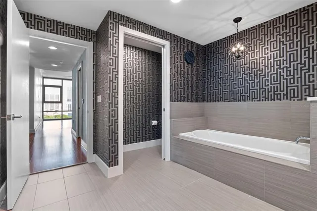 a bathroom with a granite countertop shower and a sink