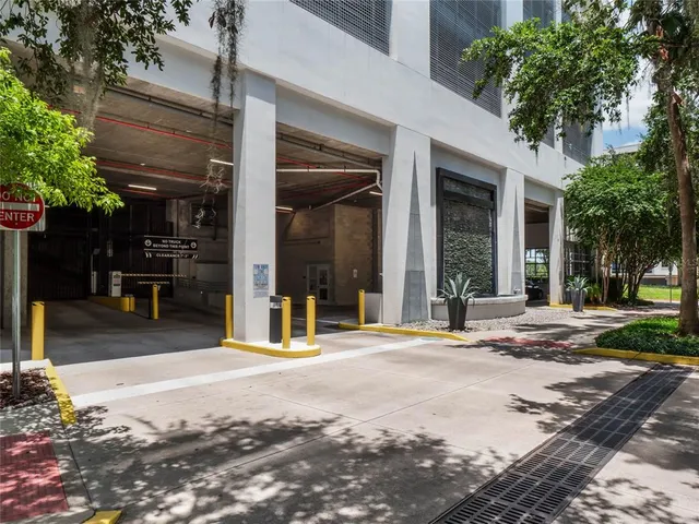 a view of a kitchen with a sink and cabinets