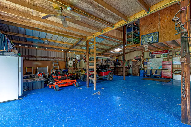 a view of a garage with a table and chairs