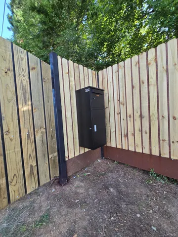 a view of balcony with wooden fence