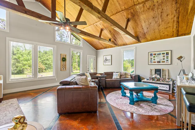 a living room with furniture and a window
