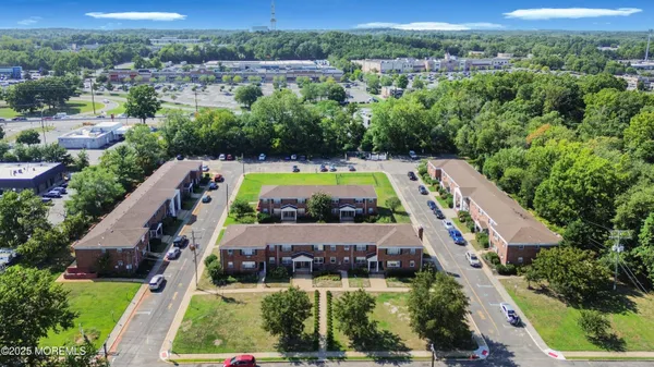 an aerial view of house with a swimming pool yard and outdoor seating