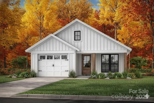 a view of a yard in front view of a house