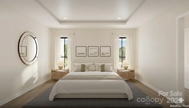 a bedroom with a large bed and a window