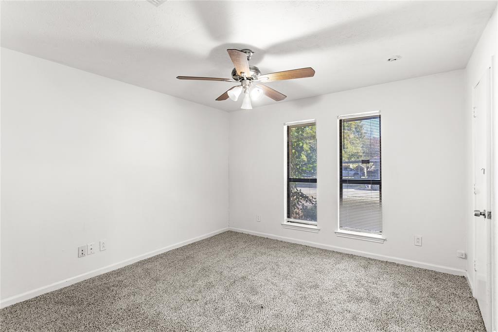 2421 Maple Leaf Drive Plano, TX 75075 - Photo 14 of 18 an empty room with windows and fan