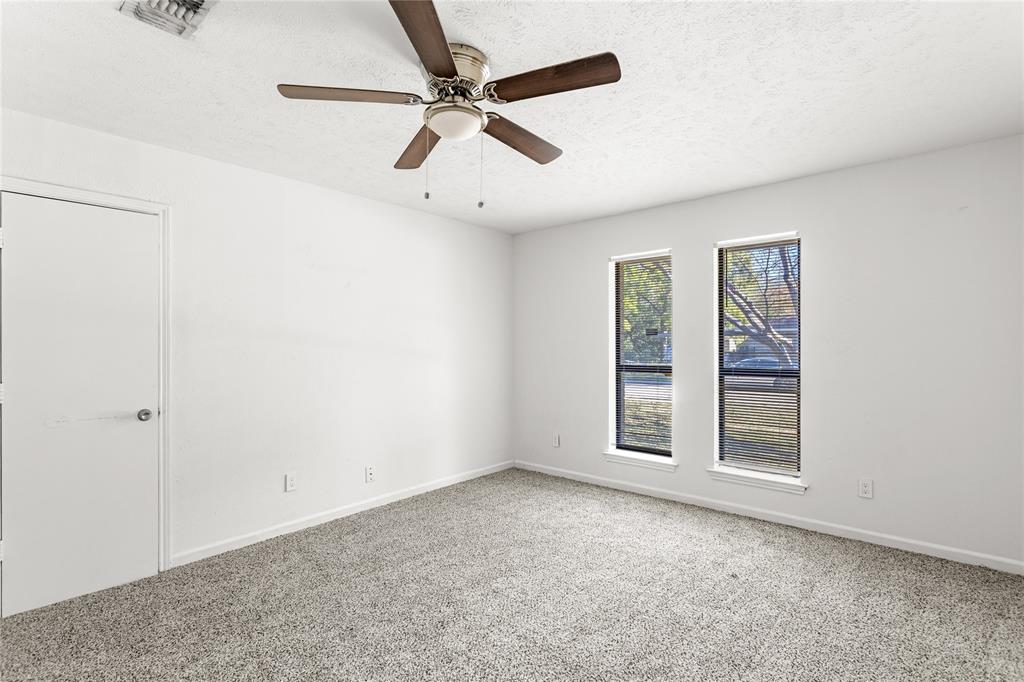 2421 Maple Leaf Drive Plano, TX 75075 - Photo 15 of 18 an empty room with windows and fan