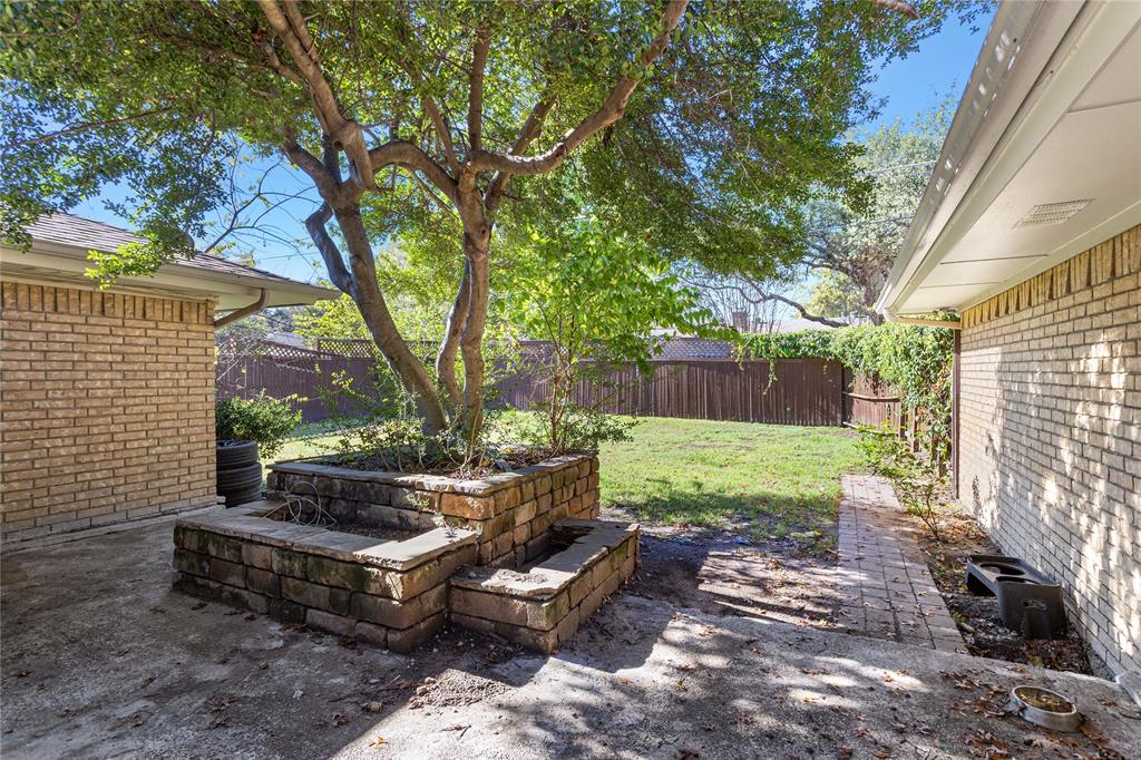 2421 Maple Leaf Drive Plano, TX 75075 - Photo 17 of 18 a garden view with a seating space