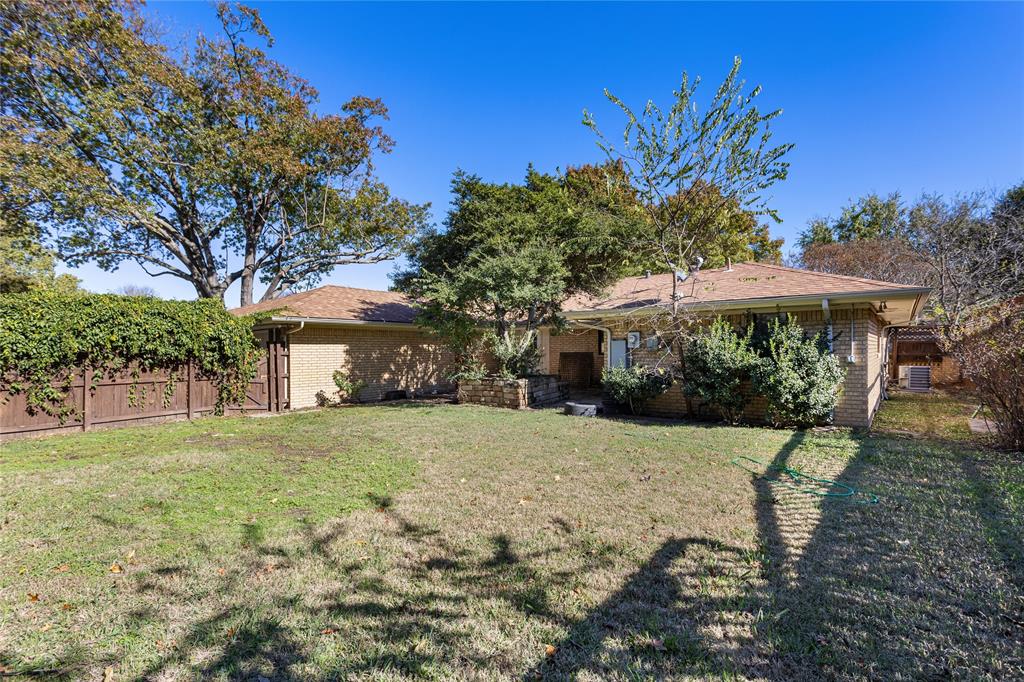2421 Maple Leaf Drive Plano, TX 75075 - Photo 18 of 18 a view of a house with a yard